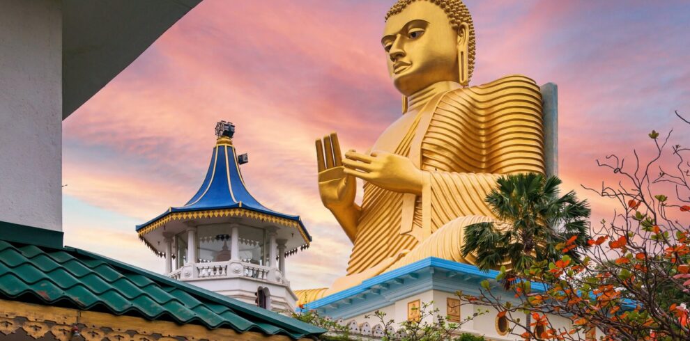 golden buddha statue in dambulla temple in sri lanka